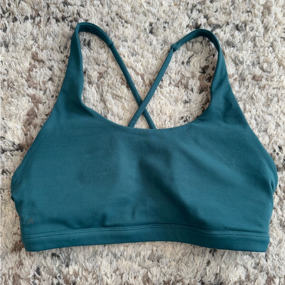 Blue Sports Bra with Criss-Cross Straps and Moisture-Wicking Fabric